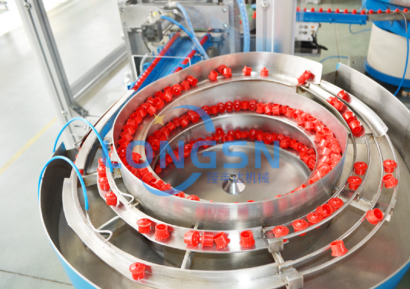 machine d'assemblage de capuchon de sport