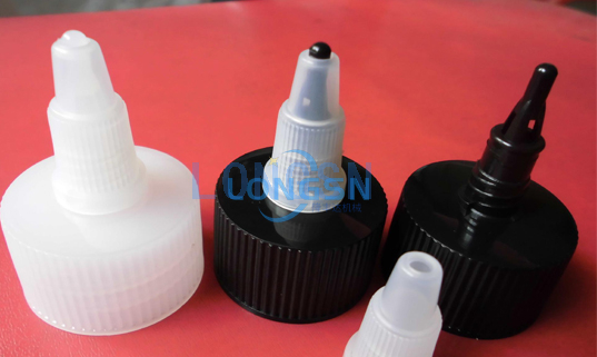 Machine d'assemblage de capuchon de bec